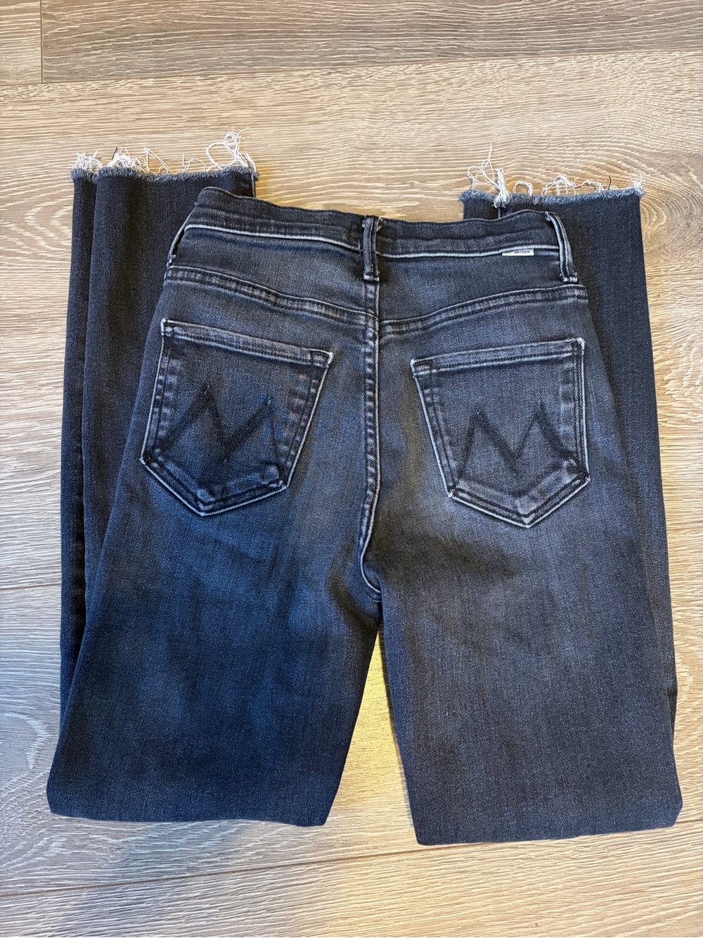 MOTHER High Waisted Rascal Ankle Snippet Jeans in Thunder Road with Raw Hem